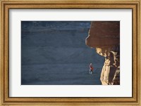 Man hanging from a rope on the edge of a cliff Fine Art Print