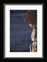 Man hanging from a rope on the edge of a cliff Fine Art Print