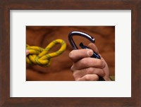 Close-up of human hands holding a carabiner and rope Fine Art Print