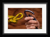 Close-up of human hands holding a carabiner and rope Fine Art Print