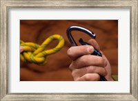 Close-up of human hands holding a carabiner and rope Fine Art Print