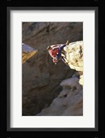 High Angle View of a Man hanging off of a Summit Fine Art Print