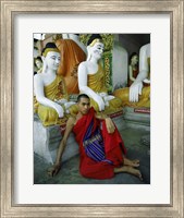 Monk Sitting in Front of a Buddha Statue Fine Art Print