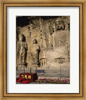 Buddha Statue in a Cave, Longmen Caves, Luoyang, China with Flowers Fine Art Print