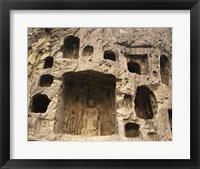 Buddha Statue Carved on a wall, Longmen Caves in China Framed Print