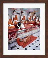 Monk Sleeping in Front of Buddha Statues Fine Art Print
