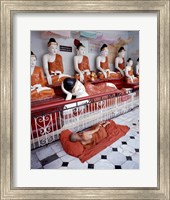 Monk Sleeping in Front of Buddha Statues Fine Art Print
