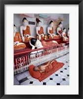 Monk Sleeping in Front of Buddha Statues Fine Art Print