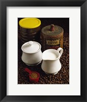 Close-up of a mug of milk with a measuring spoon and jars on coffee beans Fine Art Print