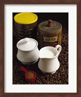 Close-up of a mug of milk with a measuring spoon and jars on coffee beans Fine Art Print