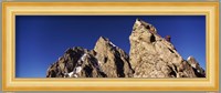 Low angle view of a man climbing up a mountain, Rockchuck Peak, Grand Teton National Park, Wyoming, USA Fine Art Print