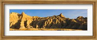 Sculpted sandstone spires in golden light, Saddle Pass Trail, Badlands National Park, South Dakota, USA Fine Art Print
