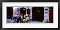 Rear view of three people standing in front of a memorial at a fire station, New York City, New York State, USA Fine Art Print