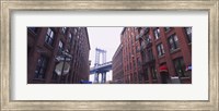Low angle view of a suspension bridge viewed through buildings, Manhattan Bridge, Brooklyn, New York City, New York State, USA Fine Art Print