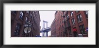 Low angle view of a suspension bridge viewed through buildings, Manhattan Bridge, Brooklyn, New York City, New York State, USA Fine Art Print