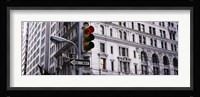 Low angle view of a Red traffic light in front of a building, Wall Street, New York City Fine Art Print
