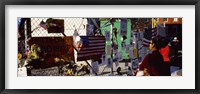 Side profile of a woman standing in front of chain-link fence at a memorial, New York City, New York State, USA Fine Art Print