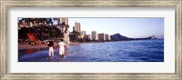Rear view of a couple wading on the beach, Waikiki Beach, Honolulu, Oahu, Hawaii, USA Fine Art Print