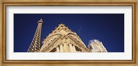 Low angle view of a building in front of a replica of the Eiffel Tower, Paris Hotel, Las Vegas, Nevada, USA Fine Art Print