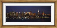 Skyscrapers lit up at night in a city, Manhattan, New York City, New York State, USA Fine Art Print