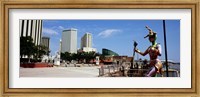 Jester statue with buildings in the background, Riverwalk Area, New Orleans, Louisiana, USA Fine Art Print