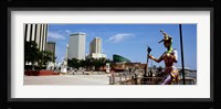 Jester statue with buildings in the background, Riverwalk Area, New Orleans, Louisiana, USA Fine Art Print