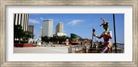 Jester statue with buildings in the background, Riverwalk Area, New Orleans, Louisiana, USA Fine Art Print