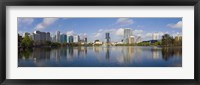 Reflection of buildings in a lake, Lake Eola, Orlando, Orange County, Florida, USA 2010 Framed Print