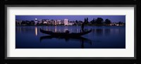 Boat in a lake with city in the background, Lake Merritt, Oakland, Alameda County, California, USA Fine Art Print
