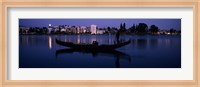 Boat in a lake with city in the background, Lake Merritt, Oakland, Alameda County, California, USA Fine Art Print