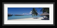 Lounge chair under a beach umbrella, Moana Beach, Bora Bora, French Polynesia Fine Art Print
