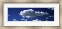 Fluffy clouds in blue sky Fine Art Print