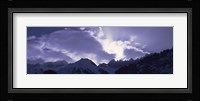 Switzerland, Canton Glarus, View of clouds over snow covered peaks Fine Art Print