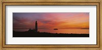 Silhouette of a lighthouse at sunset, Scotland Fine Art Print