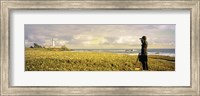 USA, California, Businessman standing holding binoculars and looking at the lighthouse Fine Art Print