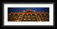 Low angle view of a building lit up at night, Harrods, London, England Fine Art Print