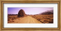 Dirt road passing through an arid landscape, Californian Sierra Nevada, California, USA Fine Art Print
