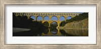 Reflection of an arch bridge in a river, Pont Du Gard, France Fine Art Print