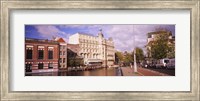 Buildings along a water channel, Amsterdam, Netherlands Fine Art Print