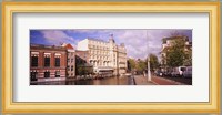 Buildings along a water channel, Amsterdam, Netherlands Fine Art Print
