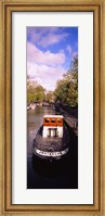 Tourboat docked in a channel, Amsterdam, Netherlands Fine Art Print