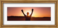 Silhouette of a person wearing boxing gloves in a desert at dusk, Black Rock Desert, Nevada, USA Fine Art Print