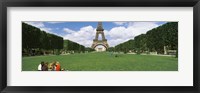 Tourists sitting in a park with a tower in the background, Eiffel Tower, Paris, Ile-de-France, France Fine Art Print