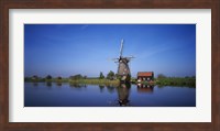 Reflection of a traditional windmill in a lake, Netherlands Fine Art Print