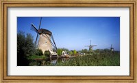 Traditional windmills in a field, Netherlands Fine Art Print
