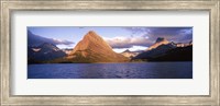 Sunlight falling on mountains at the lakeside, Swiftcurrent Lake, Many Glacier, US Glacier National Park, Montana, USA Fine Art Print