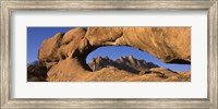 Mountains viewed through a natural arch with a mother holding her baby, Spitzkoppe, Namib Desert, Namibia Fine Art Print