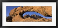 Mountains viewed through a natural arch with a mother holding her baby, Spitzkoppe, Namib Desert, Namibia Fine Art Print