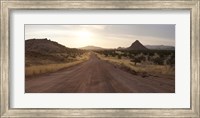 Dirt road passing through a desert, Namibia Fine Art Print