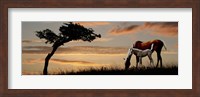 Horse mare and a foal grazing by tree at sunset Fine Art Print